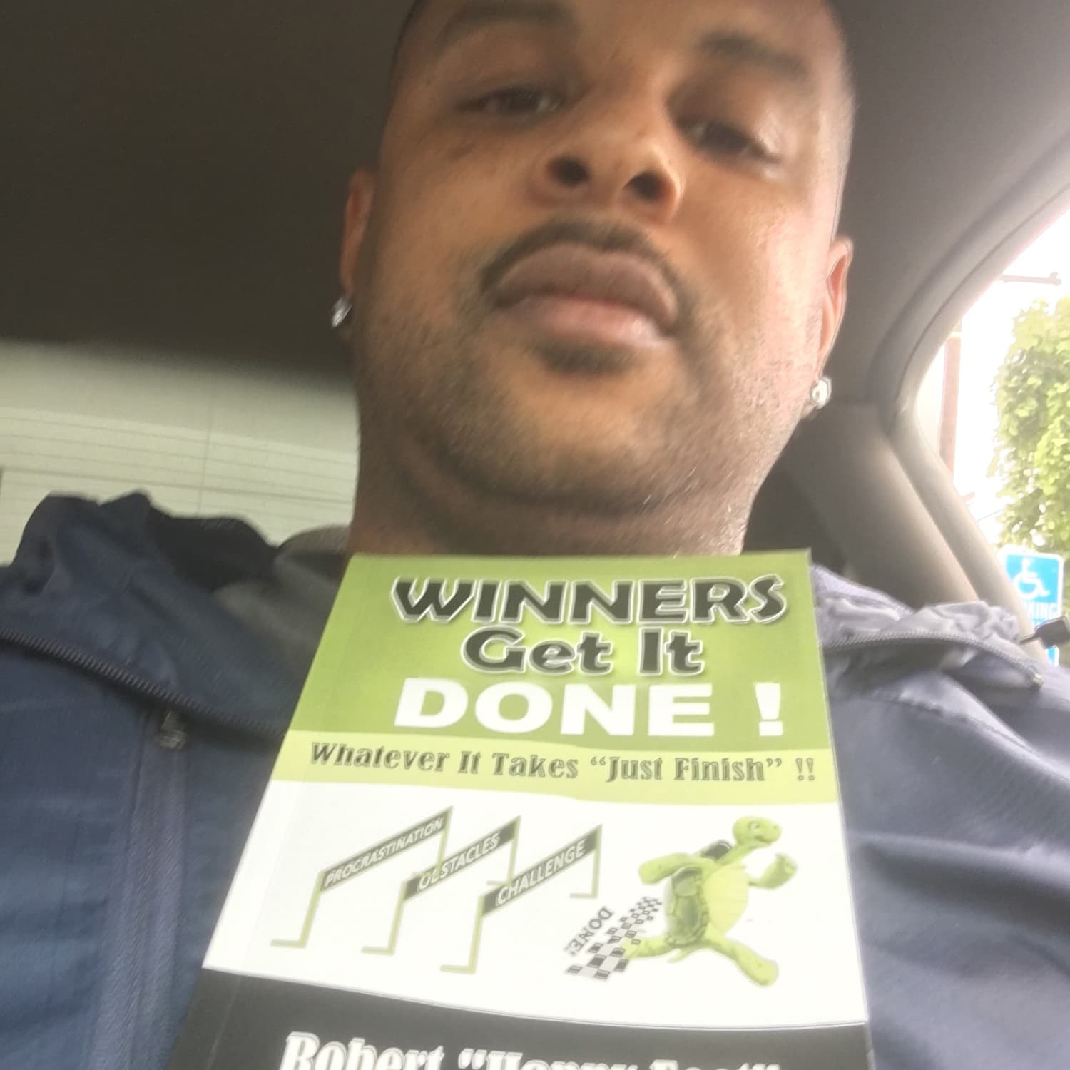 Reader holding Winners Get It Done