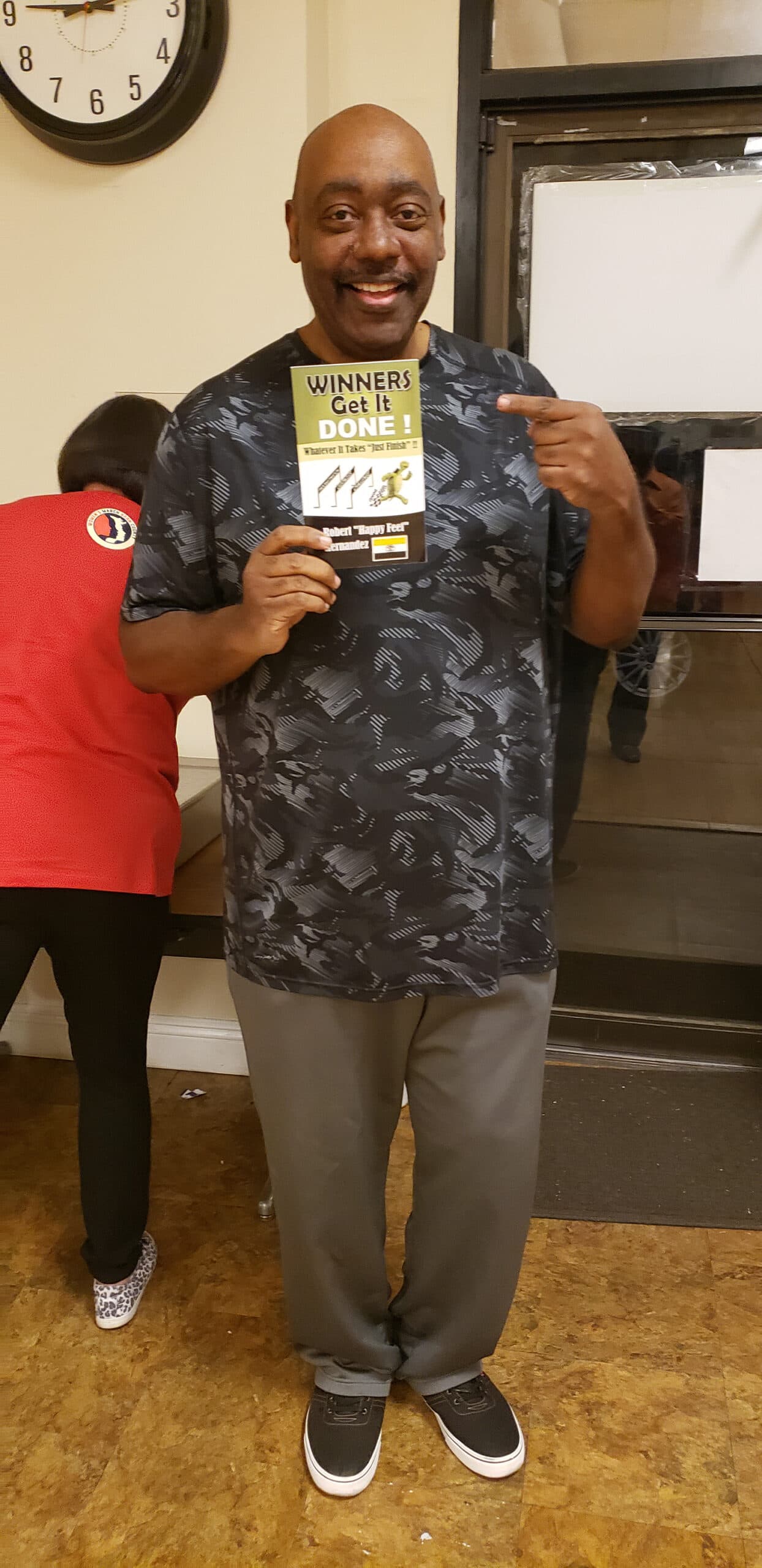 Reader holding Winners Get It Done