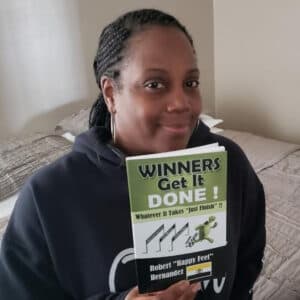 Reader holding Winners Get It Done