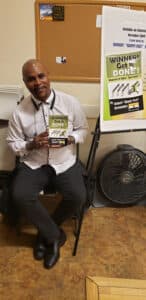 Reader holding Winners Get It Done